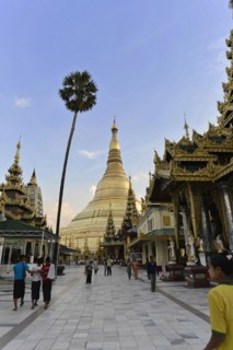Shwedagon Pagoda, Yangon, Myanmar, Asia, View of the Shwedagon Pagoda at dusk, people walking on a