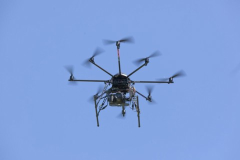 Drone with eight propellers, octocopter, in flight with camera for film and photo shoots, 07.06
