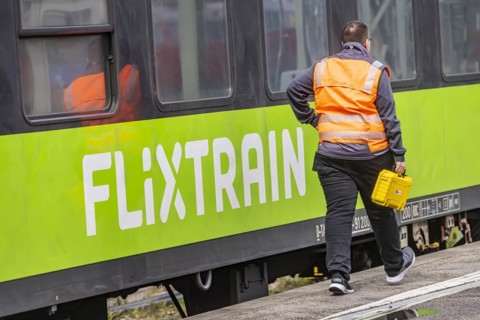 Flixtrain train at Stuttgart main station, track apron with arriving and departing trains,