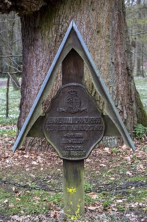 Old oak tree with the tomb of Heinrich XXXVIII Prince Reuss in Ludwigslust Castle Park,