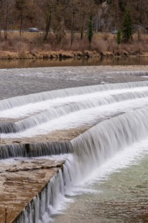 Gentle waterfall over stepped stone formation in natural surroundings, Bad Reichenhall, Bavaria,