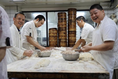 Stroll in Chongqing, Chongqing Province, China, Asia, Kitchen staff prepare dough dishes together