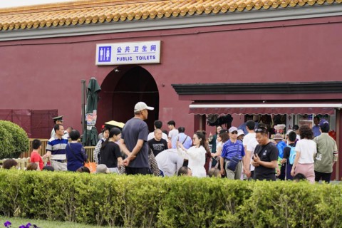 China, Beijing, Forbidden City, UNESCO World Heritage Site, group of visitors near a sign for