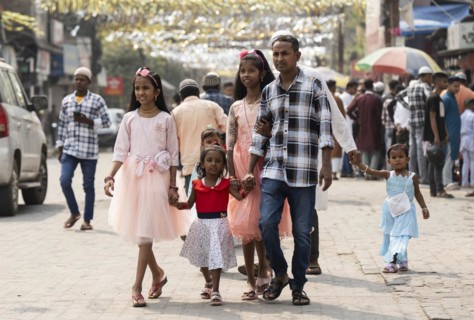 GUWAHATI, INDIA, APRIL 11: Muslim people with children walk towards an Eidgah to perform Eid