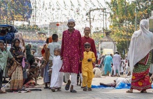 GUWAHATI, INDIA, APRIL 11: Muslim people with children walk towards an Eidgah to perform Eid