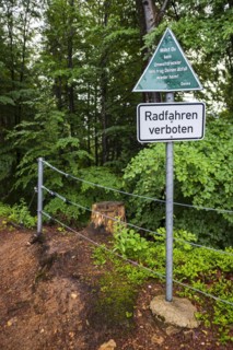 Keeping the environment clean, message to polluters and cyclists on a sign at the upper entrance to