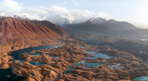 Atmospheric aerial view, high mountain landscape with glacier moraines and mountain lakes, behind