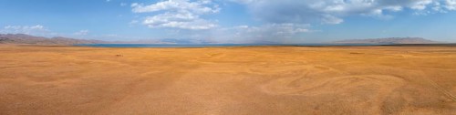 Aerial view, Vast empty landscape at the mountain lake Song Kul in autumn, Moldo Too Mountains,