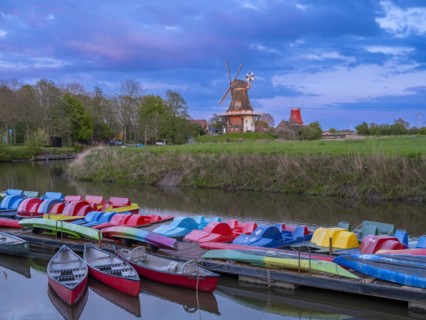 The Greetsiel twin mills, in front boats in the new Greetsieler Sieltief, Greetsiel, Krummhoern,