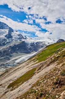 View from Franz Joseph Hoehe into the mountains (Grossglockner) with Pasterze on a sunny day at