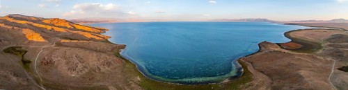 Aerial view, Vast empty landscape at the mountain lake Song Kul, Moldo Too Mountains, Naryn region,