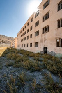 Abandoned destroyed residential building, Sun Star, old Soviet apartment block in the ghost town,