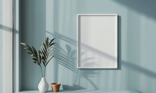 A blank image frame mockup on a pale gray-blue wall in a minimalistic modern interior room AI