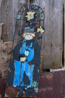 Discarded welcome sign leaning against a wooden wall, Bavaria, Germany, Europe