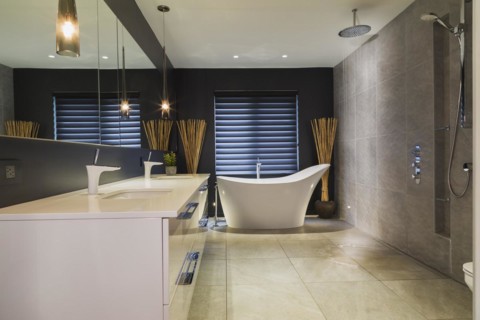 White high-gloss lacquered vanity with quartz countertop and his and her sunken sinks, freestanding