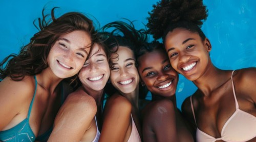 A group of women are smiling and posing for a photo. They are wearing bikinis and hats, AI