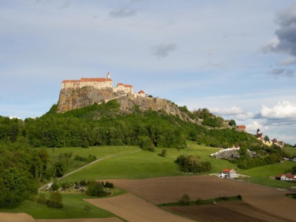 Riegersburg in the evening light, foreground farmland, Riegersburg, Styrian volcanic region,