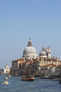 Water taxis, and vaporetto with Renaissance architectural style palace buildings and Santa Maria