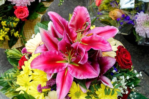 A colourful bouquet of pink Lily (Lilium candidum) and yellow flowers, flower sale, Central