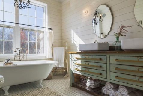 Green antique finish pine wood vanity with rustic wood plank countertop and white top-mounted his
