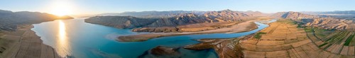 Panorama, River mouth of the Naryn River at Toktogul Reservoir at sunset, aerial view, Kyrgyzstan,