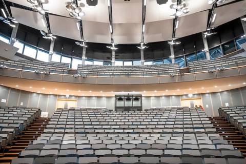View from the lectern onto rows of seats in an empty lecture theatre, interior view, Department of