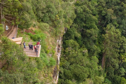 CANELA, BRAZIL, May 12, 2019. Tourists observing a snail cascade (Cascade of Caracol) in park