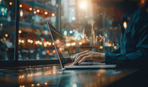 Concept of productivity. Businessman uses laptop to analyze marketing and productivity data, AI