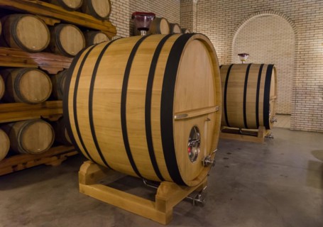 Oak barrels for wine aging in an underground cellar in Vale dos Vinhedos