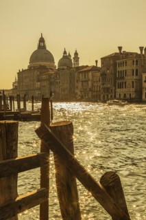Silhouetted view of Grand canal with water taxis, Santa Maria della Salute basilica and Renaissance