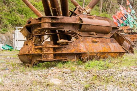 Closeup of large rusted metal anchor used on large fishing vessels in NamHae, South Korea, Asia