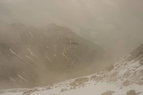 Cable car technicians working in bad weather conditions, Nebelhorn cable car near Oberstdorf,