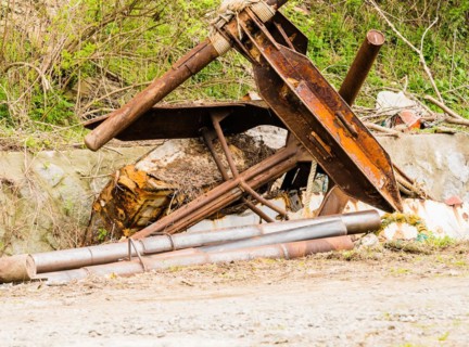 Closeup of large rusted metal anchor used on large fishing vessels in NamHae, South Korea, Asia