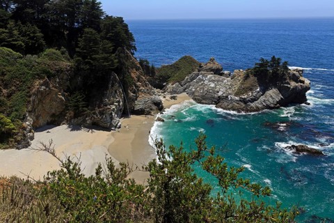 A waterfall pours into the sea on a sandy beach, Big Sur Pfeiffer, US 1, North America, USA,