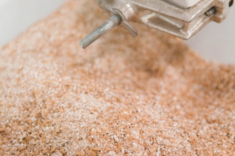 Traditional homebrewing malt grinder, grinding pilsen malt