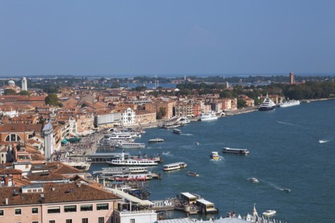 Water taxis and vaporettos along the Riva degli Schiavoni promenade plus old Renaissance