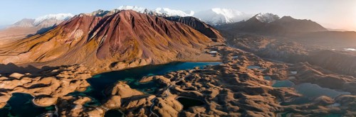 Aerial view, high mountain landscape with glacial moraines and mountain lakes, behind Pik Lenin,