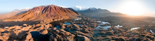 Aerial view, high mountain landscape with glacial moraines and mountain lakes, behind Pik Lenin,