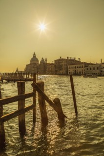 Silhouetted view of Grand canal with water taxis and Santa Maria della Salute basilica in