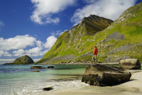 Landscape with sea at the sandy beach of Haukland (Hauklandstranda) with the mountain Veggen. A