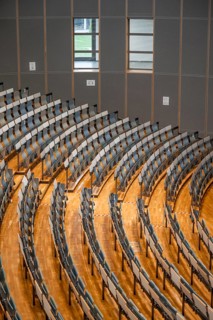 View from above of empty rows of seats in a lecture theatre, interior photo, Department of