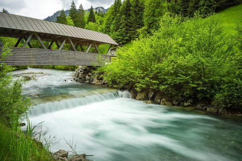 Covered wooden bridge over the Stillach, Stillachtal near Oberstdorf, Allgaeu Alps, Allgaeu,
