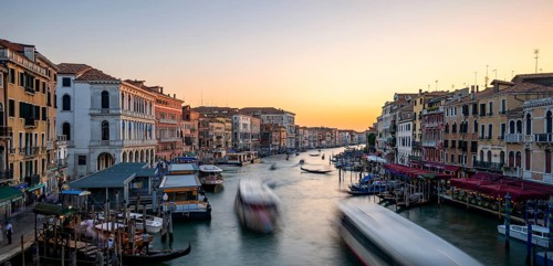 Vaporettos on the Grand Canal at sunset, long exposure, view from the Rialto Bridge, Venice,