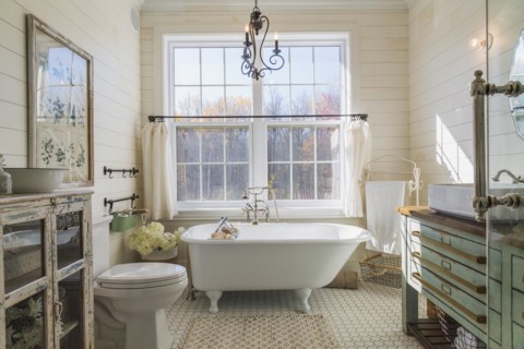 Green antique finish pine wood vanity with rustic wood plank countertop and white top-mounted