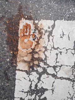Handprint on a zebra crossing, after removal of a climate sticker, Leoben, Styria, Austria, Europe