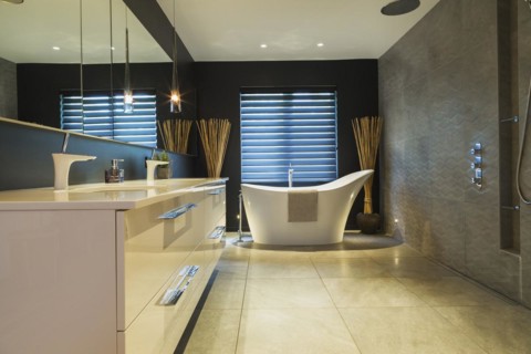 White high-gloss lacquered vanity with quartz countertop and his and her sunken sinks, freestanding