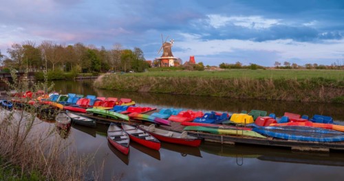 The Greetsiel twin mills, in front boats in the new Greetsieler Sieltief, Greetsiel, Krummhoern,