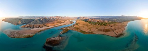 Panorama, River mouth of the Naryn River at Toktogul Reservoir at sunset, aerial view, Kyrgyzstan,