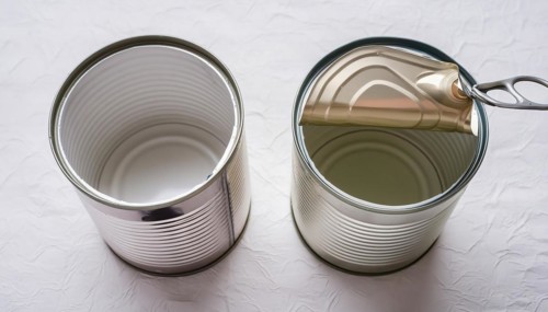 Symbol photo, two empty open cans on a white surface, AI generated, AI generated