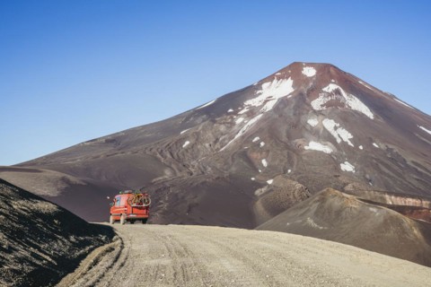 Campervan in front of the Lonquimay volcano, Lonquimay volcano, Malalcahuello National Reserve,